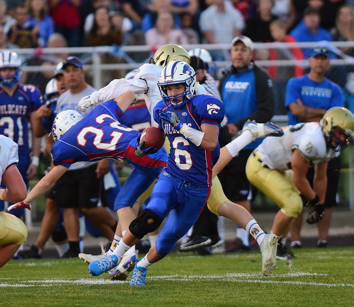 Columbia Falls Sean Miller (6) runs back an interception in the first half against Dillon Friday night. (Chris Peterson photo).