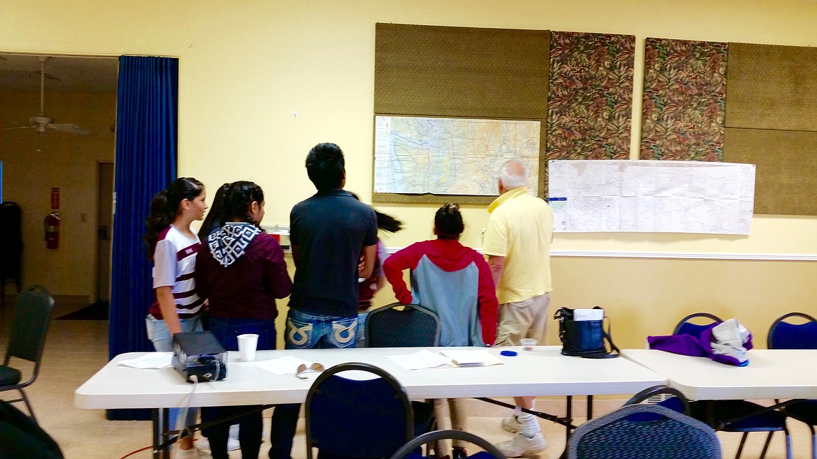 Susie Gruber/Courtesy Photo - Karl Gruber, manager of the Desert Aire Airport teaches students about flight planning, weather and navigation. He brought his Piper Cherokee for the students to see.