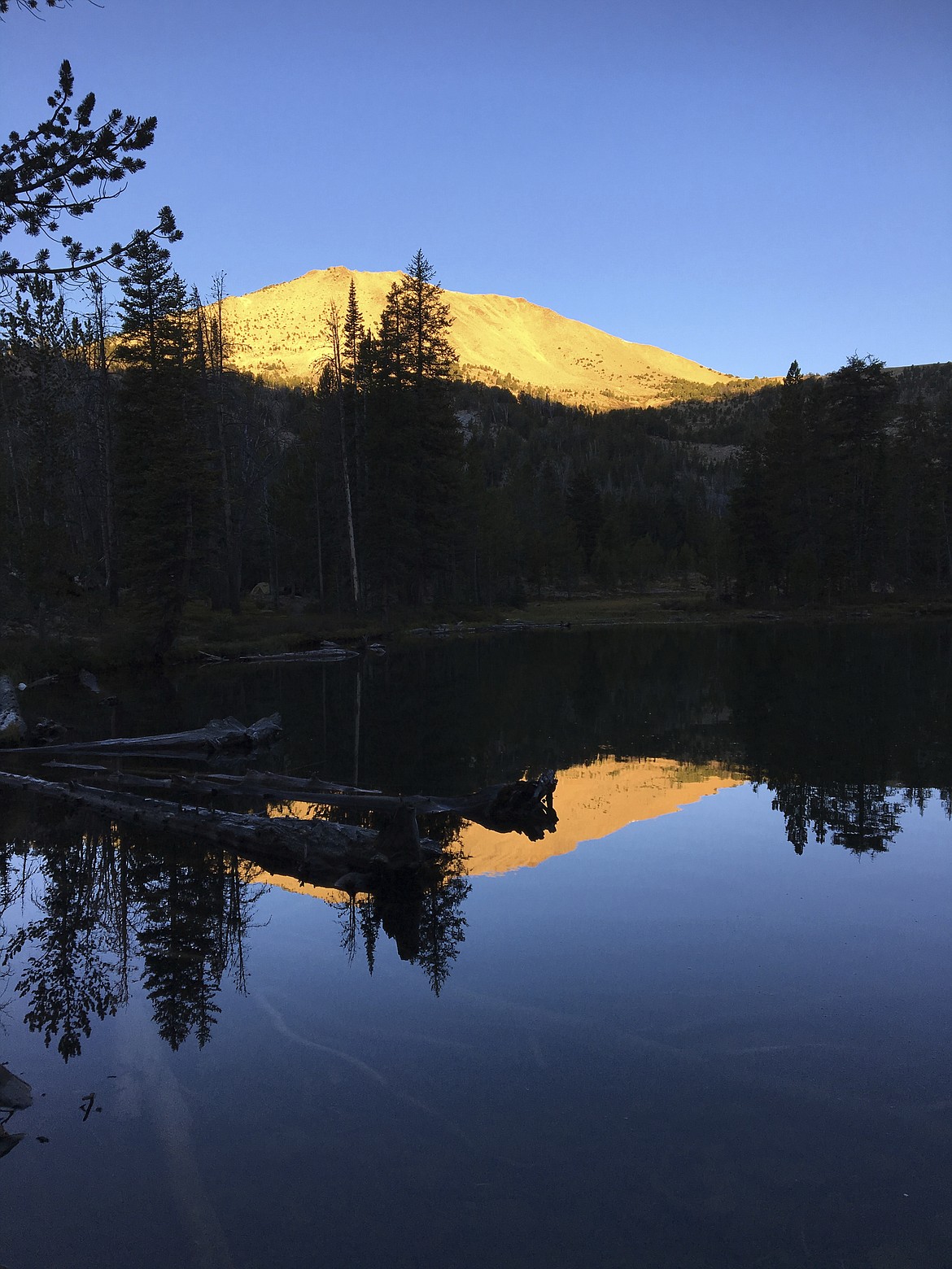 In a Sept. 11, 2016 photo,the rising sun illuminates a peak over Washington Lake northeast of Sun Valley, Idaho, in the White Cloud Mountains.  (Scott McIntosh/Idaho Press Tribune via AP)