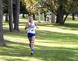 Peacock ties school record in cross country