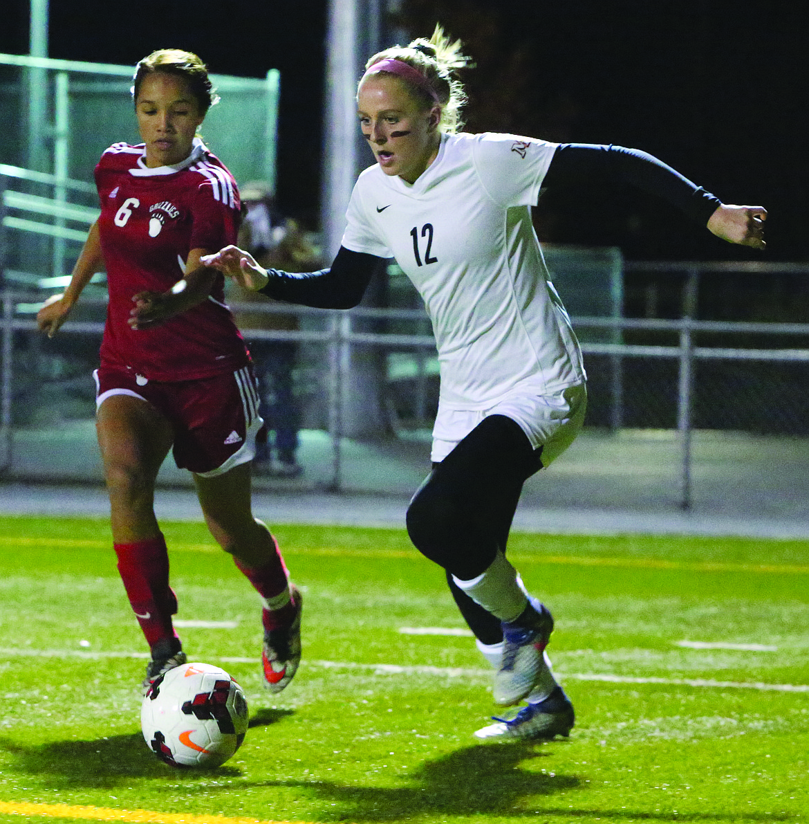 Connor Vanderweyst/Columbia Basin Herald 
Moses Lake's Morgan Skone (12) looks for a pass against Sunnyside Thursday at Lions Field.