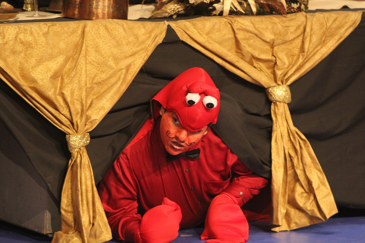 Richard Byrd/Columbia Basin Herald
Sebastian the Crab (Andrew Covarrubias) hides from Chef Louis to avoid being served as dinner in &#147;The Little Mermaid.&#148;