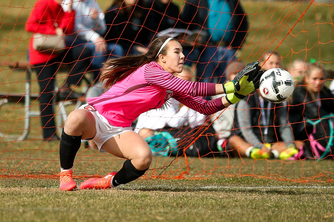 &#151;Photo by JASON DUCHOW PHOTOGRAPHY
Sandpoint freshman goalie Shea Kilpatrick makes a key save in the shootout on Thursday in the state opener in Idaho Falls, helping the Bulldogs advance to the semis.