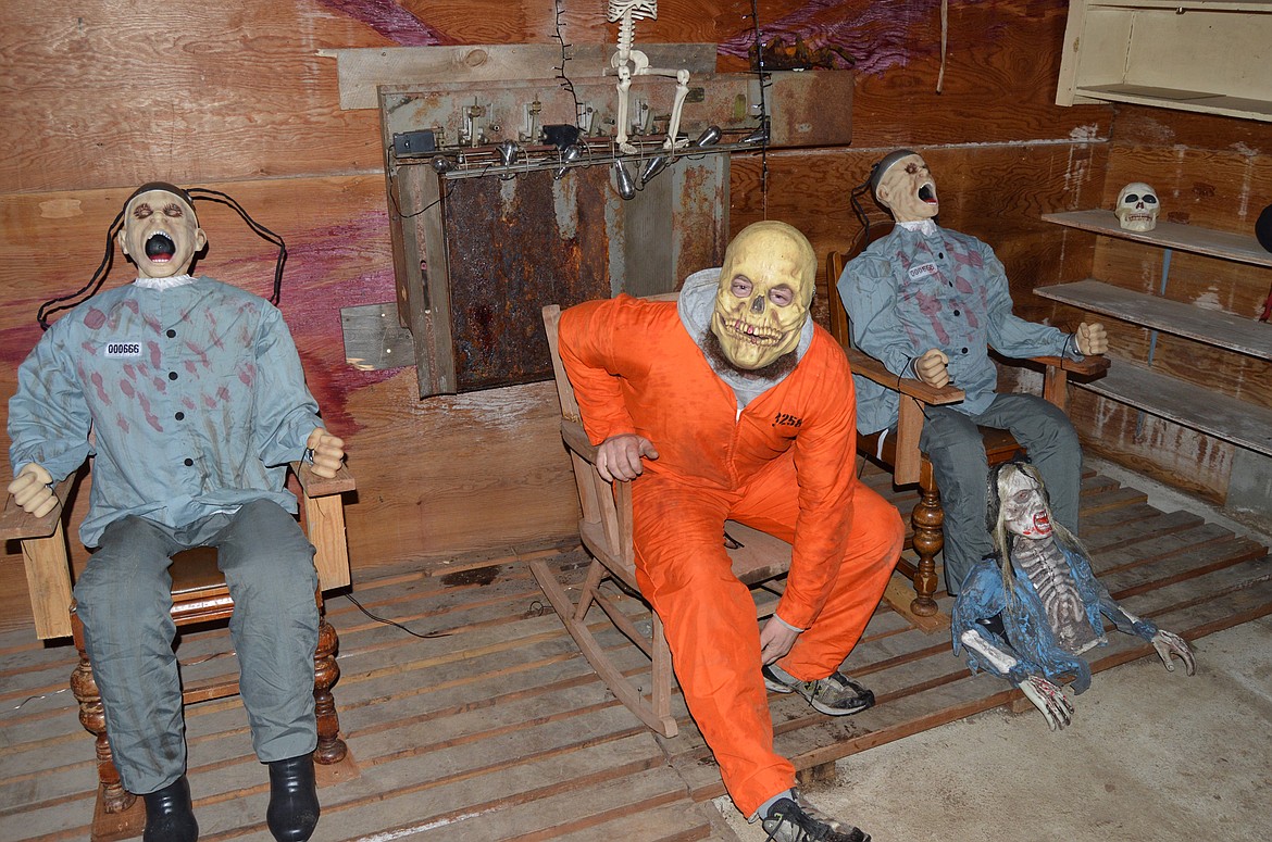 A scare actor waits to jump up from an electric chair in the Hungry Horse Haunted House (Anna Arvidson photo).