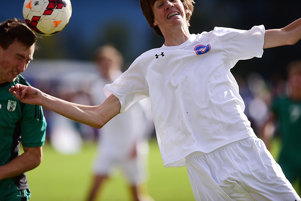 Tristan Grein fights for possession against a Belgrade defender (left). (Chris Peterson/Hungry Horse News photo)