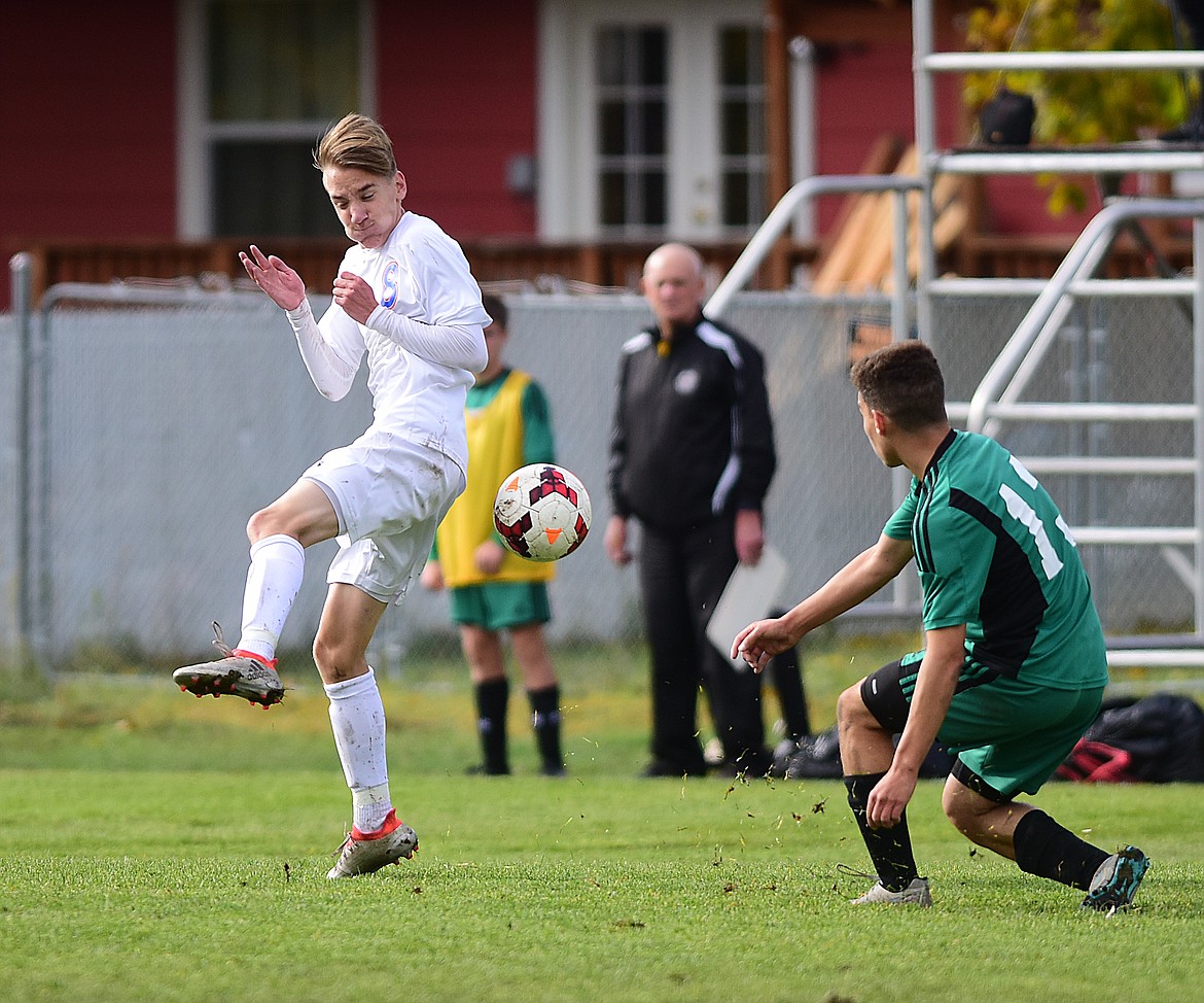 Jakob Grien looks to block a pass by a Belgrade player.