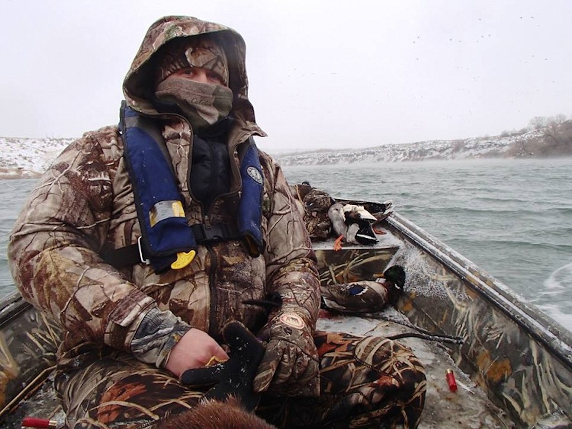 &#151;Photo courtesy IDAHO DEPARTMENT OF FISH &amp; GAME
A duck hunter waits for the waterfowl to show up as he comes prepared for the cold conditions.