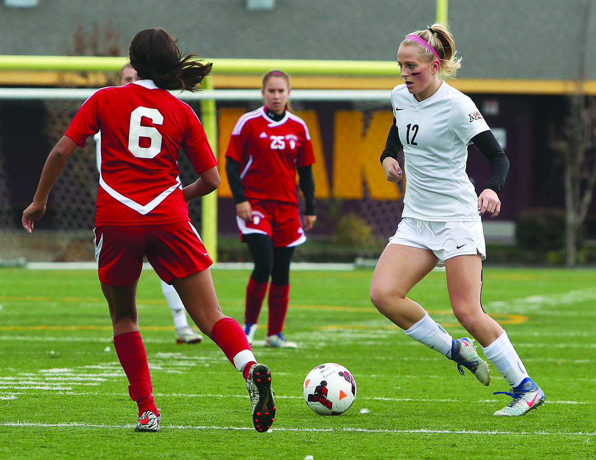 Connor Vanderweyst/Columbia Basin Herald
Moses Lake&#146;s Morgan Skone dribbles past a Sunnyside defender Saturday at Lions Field.