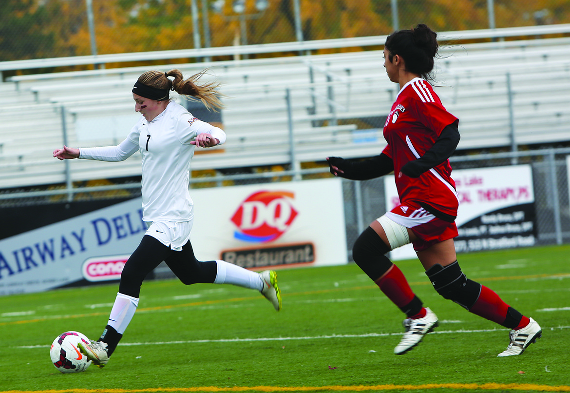 Connor Vanderweyst/Columbia Basin Herald
Moses Lake defender Denali Knowles shoots and scores in the first half against Sunnyside.