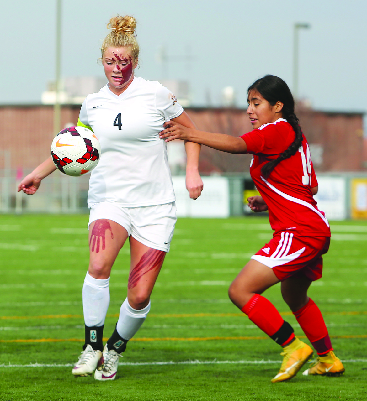 Connor Vanderweyst/Columbia Basin Herald
Moses Lake&#146;s Cora Bruneel (4) shakes off a Sunnyside player Saturday at Lions Field.