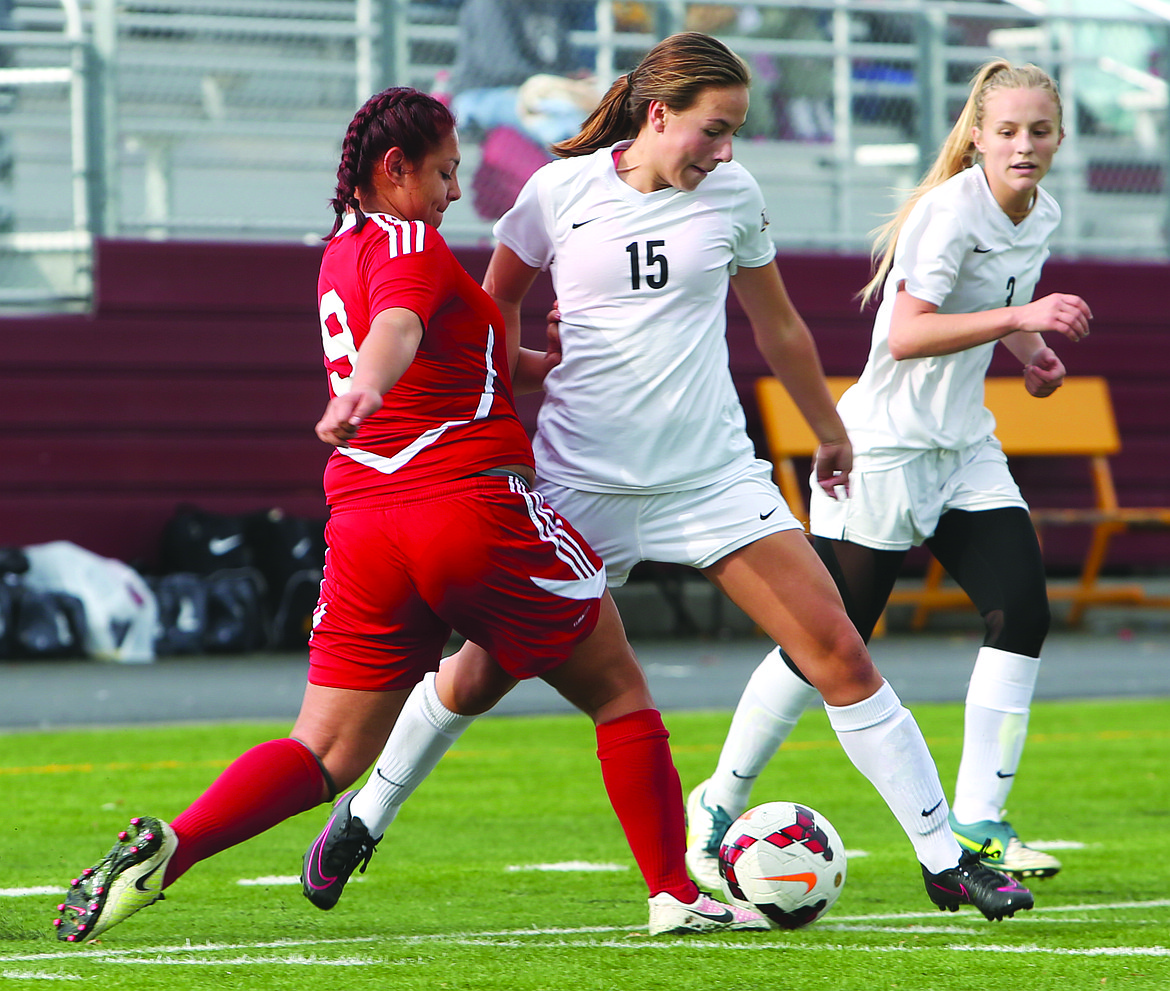 Connor Vanderweyst/Columbia Basin Herald
Moses Lake&#146;s Christina Mullan (15) and Kennady Schlagel (3) try to keep the ball from Sunnyside&#146;s Briana Granados Saturday at Lions Field.