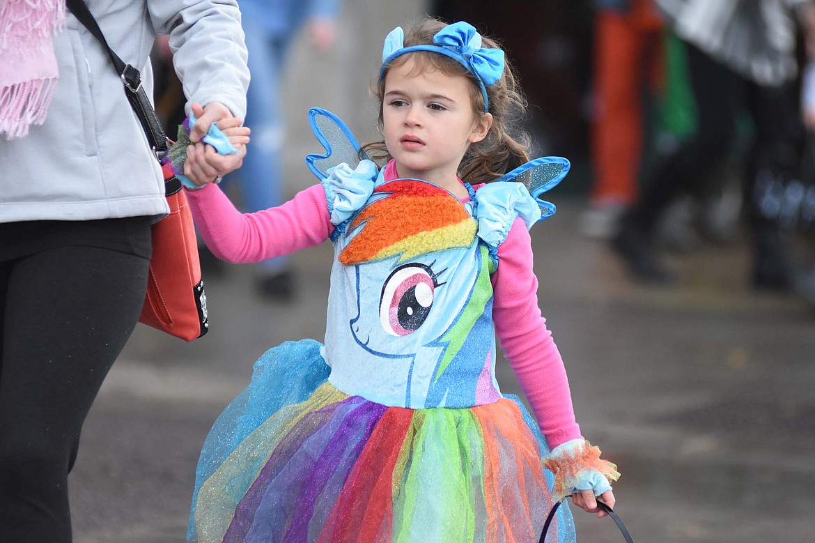 Children in costume filled Central Avenue Monday trick-or-treating at downtown businesses for Halloween.