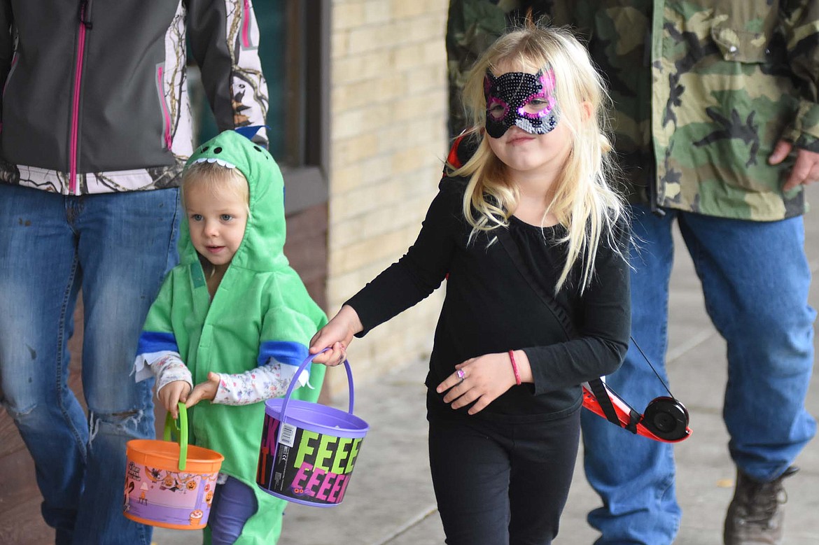 Children in costume filled Central Avenue Monday trick-or-treating at downtown businesses for Halloween.