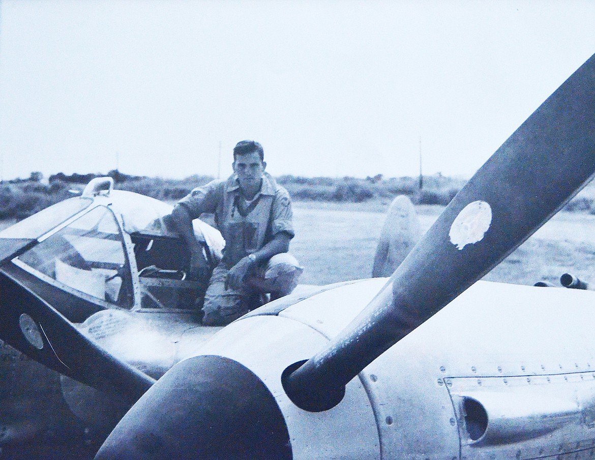 Paul Marshall on his plane during World War II.