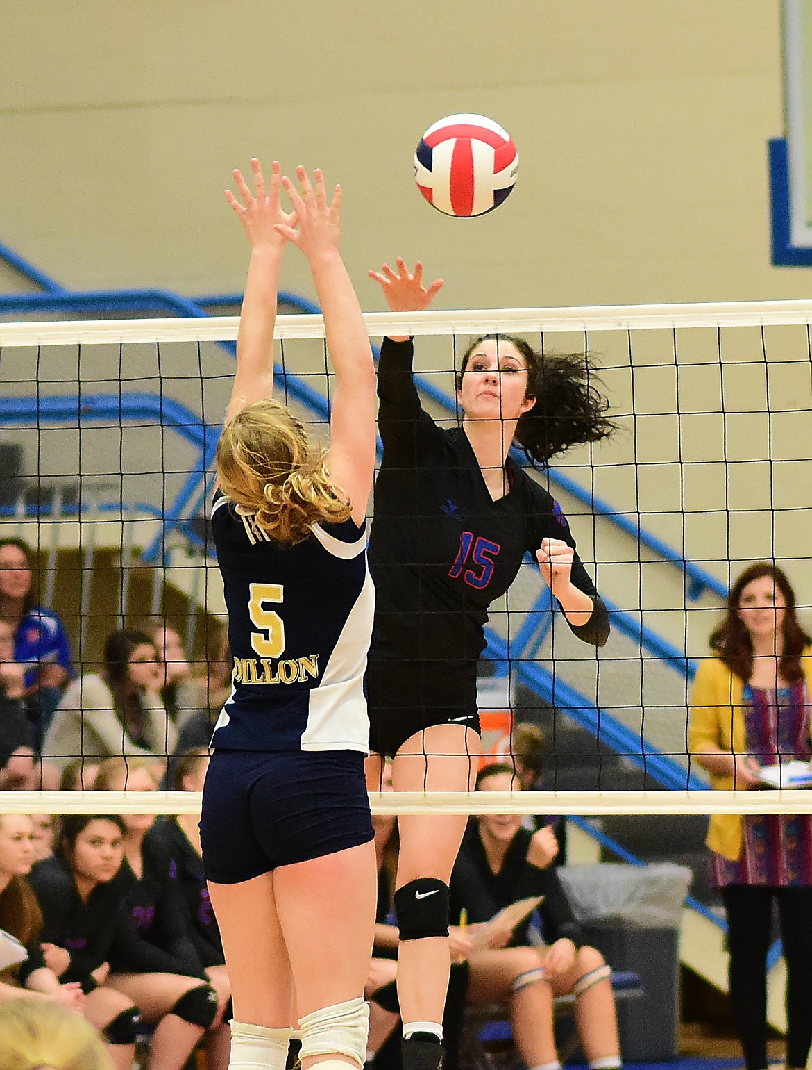 Morgan Stenger swats the ball over the net against Dillon.