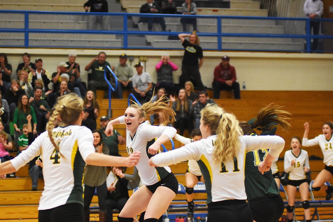 Anissa Brown celebrates with her teammates during a win against Dillon in the Western A divisional tournament.