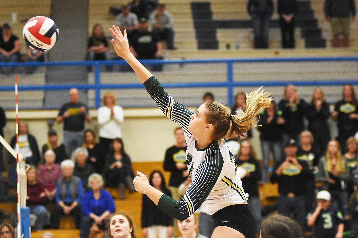 Cailyn Ross spikes the ball against Columbia Falls during the Western A divisional title match Saturday.