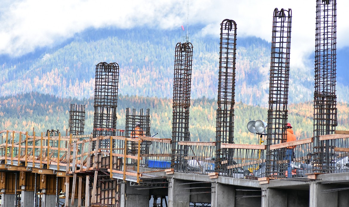 Construction workers last week prepare the parking structure attached to City Hall to receive a major concrete pour for the third deck of the parking structure. When completed  he parking structure will have parking for about 200 cars.