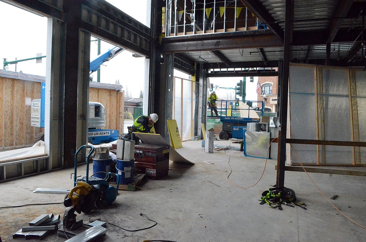 The lobby area of the new City Hall building features large windows and the entrance to the building at the corner of Baker Avenue and Second Street.