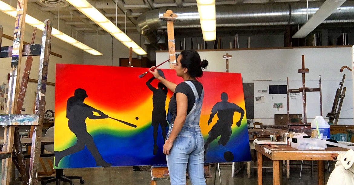 Courtesy Photo - One of Natasha Rodelo&#146;s favorite pieces is one of athletes in silhouette at Time Out Pizza in Othello. She did this work at the Central Washington University studio while attending college.