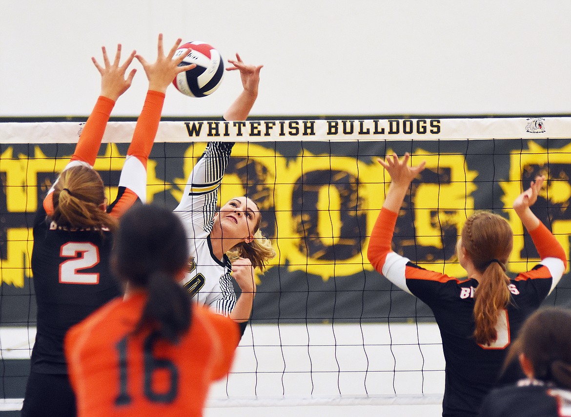 Junior Cailyn Ross rises for a kill against Frenchtown.