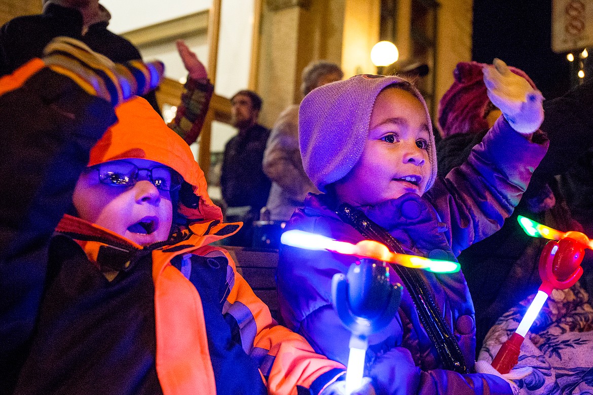 JAKE PARRISH/Press file

Bundled up against the 20-degree Fahrenheit chill, Cameron Hirth, left, and Laeyla Brooks, both 3, hold light-up toys and wave at passing parade floats on Friday, Nov. 27, 2015 at the annual holiday parade preceding the 29th Annual Coeur d&#146;Alene Resort Holiday Light Show on Sherman Avenue in Coeur d&#146;Alene.