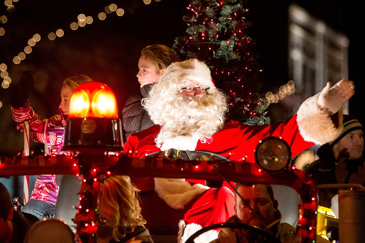 JAKE PARRISH/Press file

The man of the night, Santa Claus, waves from his firetruck &#147;sleigh&#148; to the some 30,000 people lining Sherman Avenue at the holiday parade preceding the 29th Annual Coeur d&#146;Alene Resort Holiday Light Show on Friday, Nov. 27, 2015. More than 35 entries were in the parade, which begun at Sherman Avenue and 8th Street and ended at The Coeur d&#146;Alene Resort.