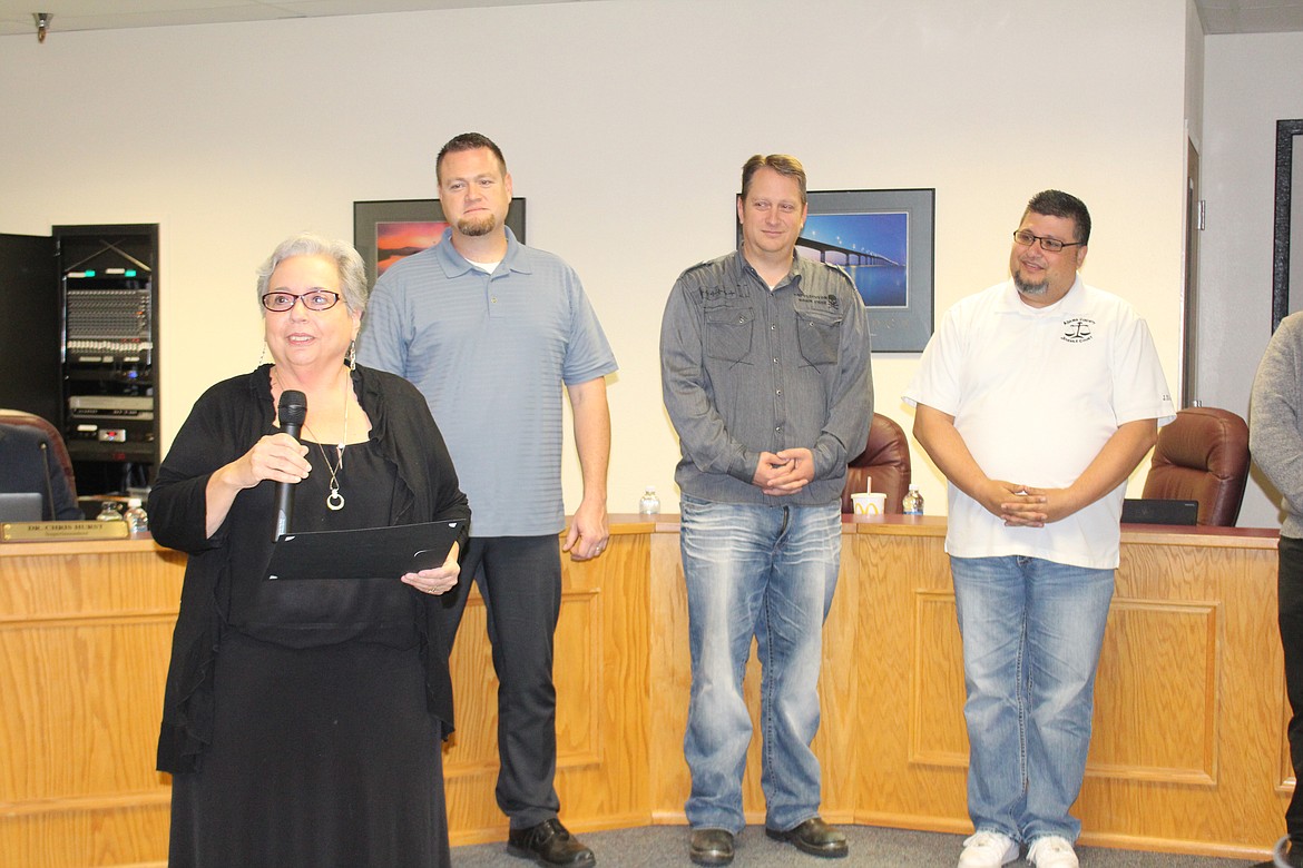 Cheryl Schweizer/Columbia Basin Herald
School psychologist Jenny Marsh (foreground) was recognized by the Othello School Board members Monday. Board members (from left) Rob Simmons, Tony Ashton and Juan Garza listen in.