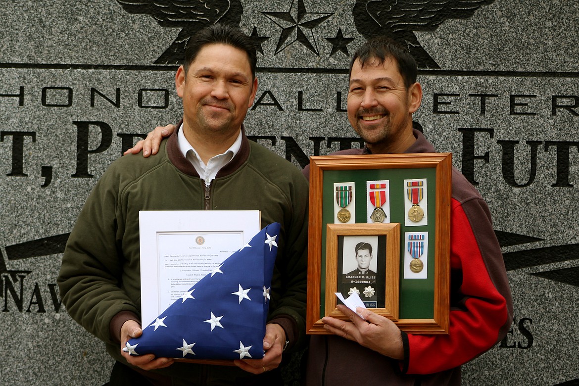 Photo by STAR SILVA
Jack, left, and brother, Cory Bliss, receive an honorary flag and certificate on behalf of their late father, Col. Charles Bliss.