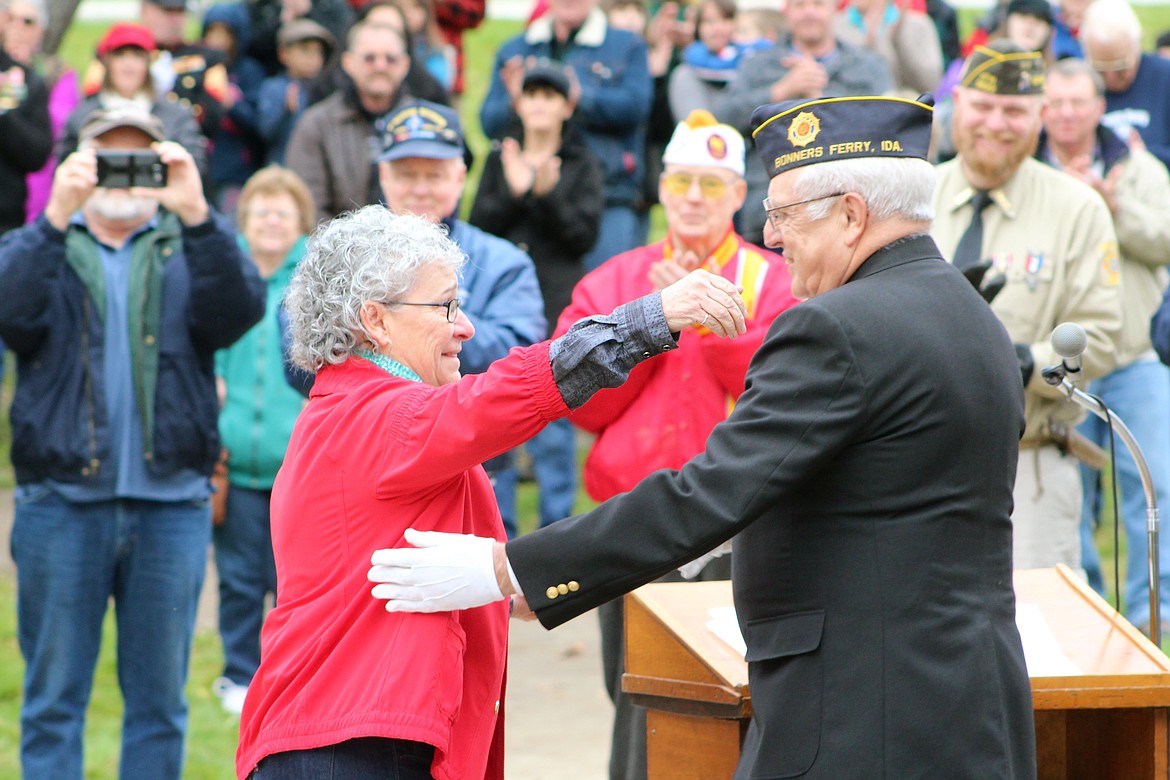 &#151;Photo by STAR SILVA
Margaret Mellet receives a plaque of appreciation from members of American Legion Post 55 for making quilts of valor  during Friday's Veterans Day ceremony at Veteran Memorial Park, downtown Bonners Ferry.