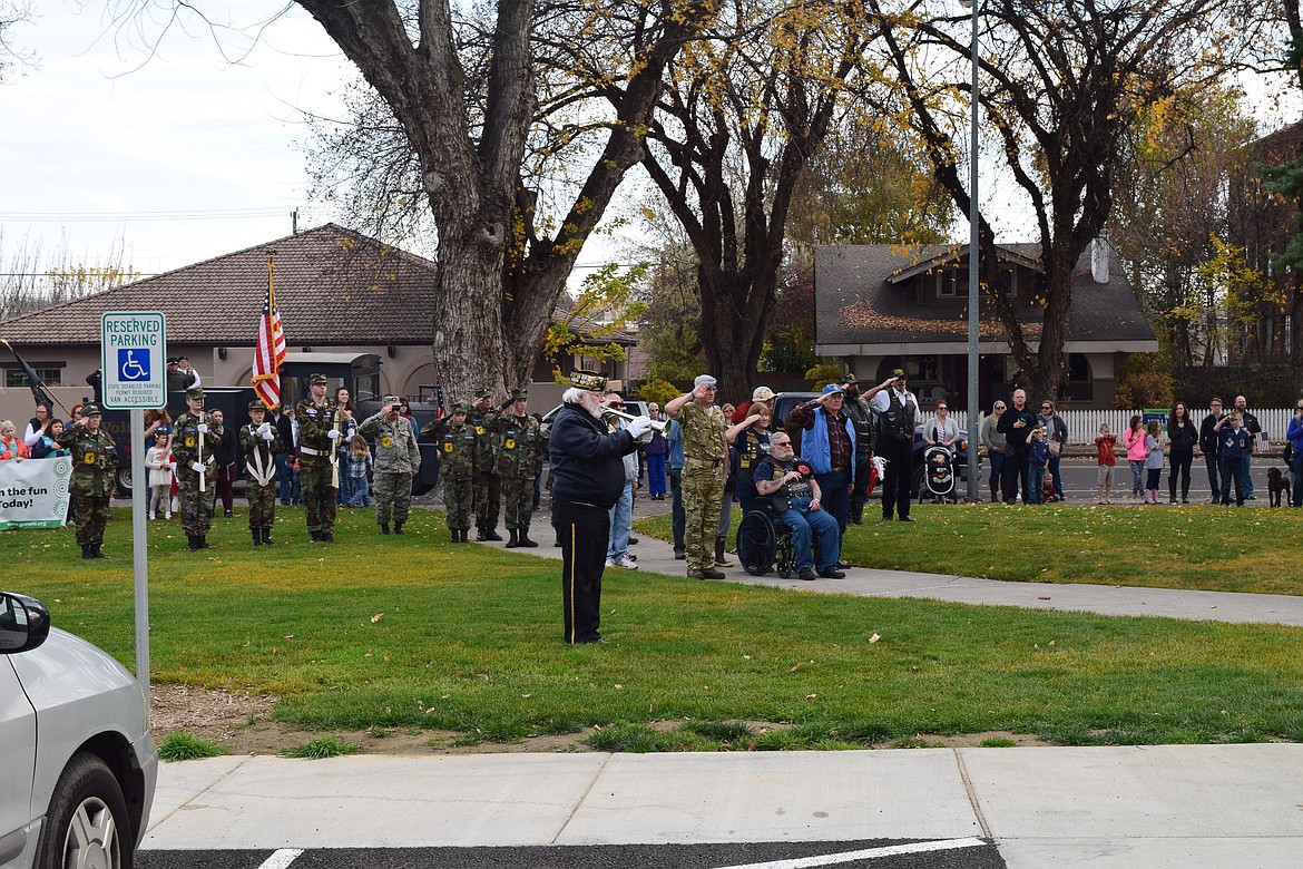 Joel Martin/Columbia Basin Herald
Bugler Richard Radder plays &#145;Taps&#146; at the Vietnam War Memorial in front of the Grant County Courthouse following the Veterans Day Parade Friday.