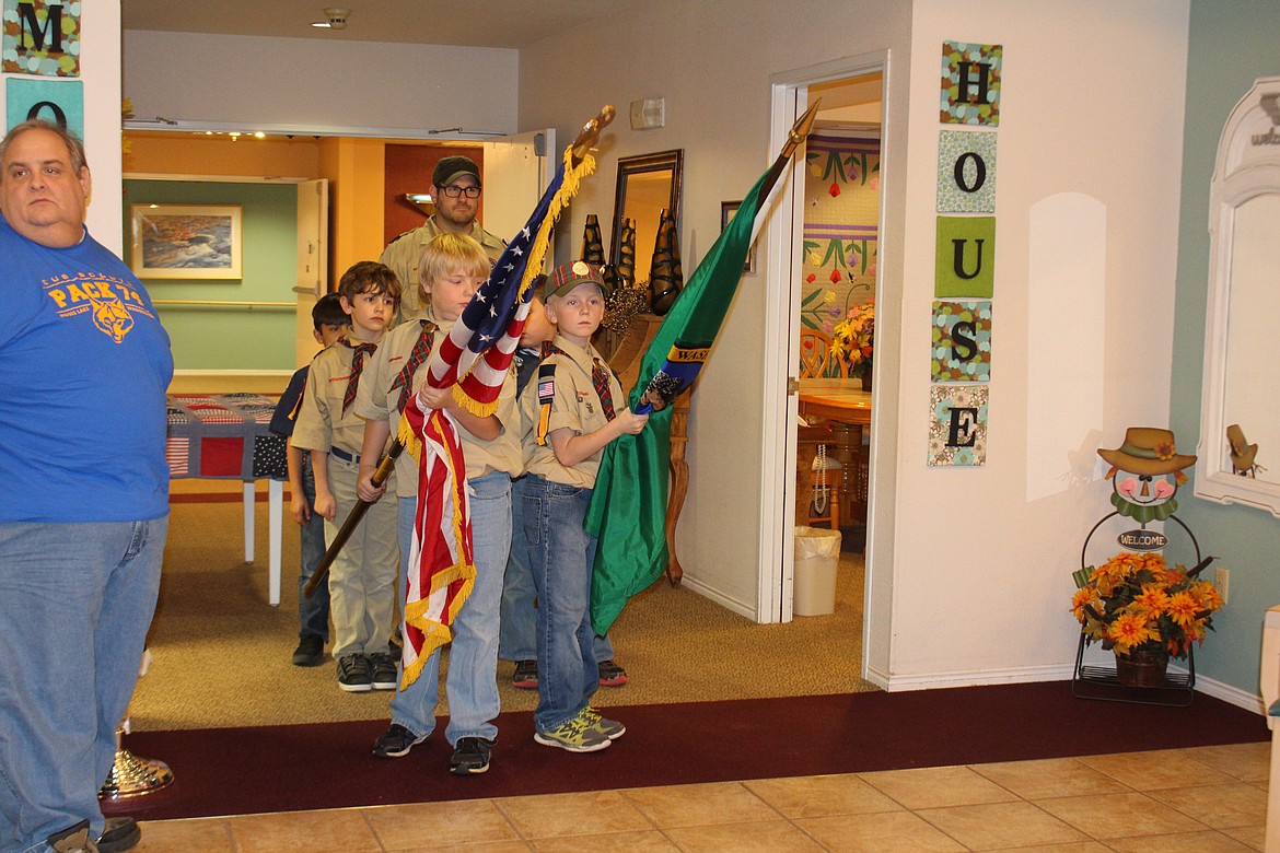 Cheryl Schweizer/Columbia Basin Herald
Scouts from Pack 74 presented the colors and led the Pledge of Allegiance during a Veterans Day ceremony at Monroe House Friday.