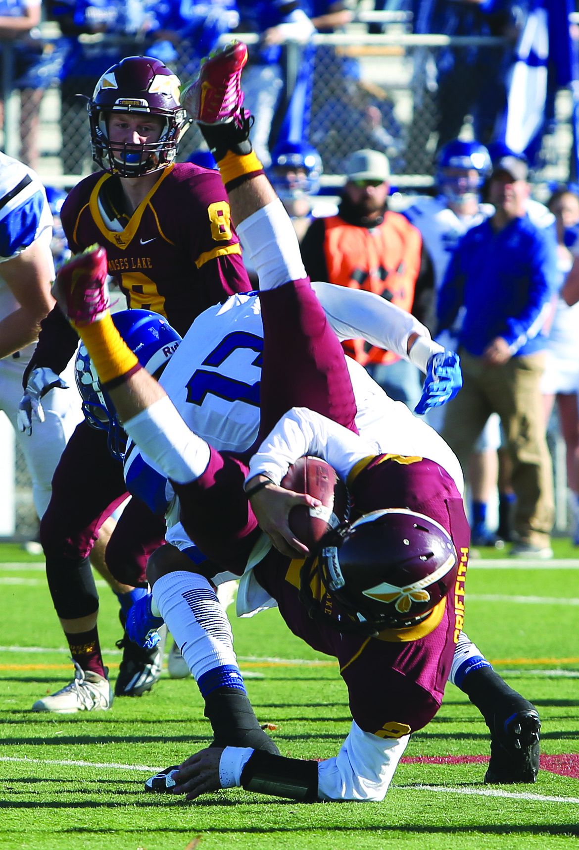 Connor Vanderweyst/Columbia Basin Herald
Moses Lake quarterback Brandon Griffith is upended by a Bothell defender.