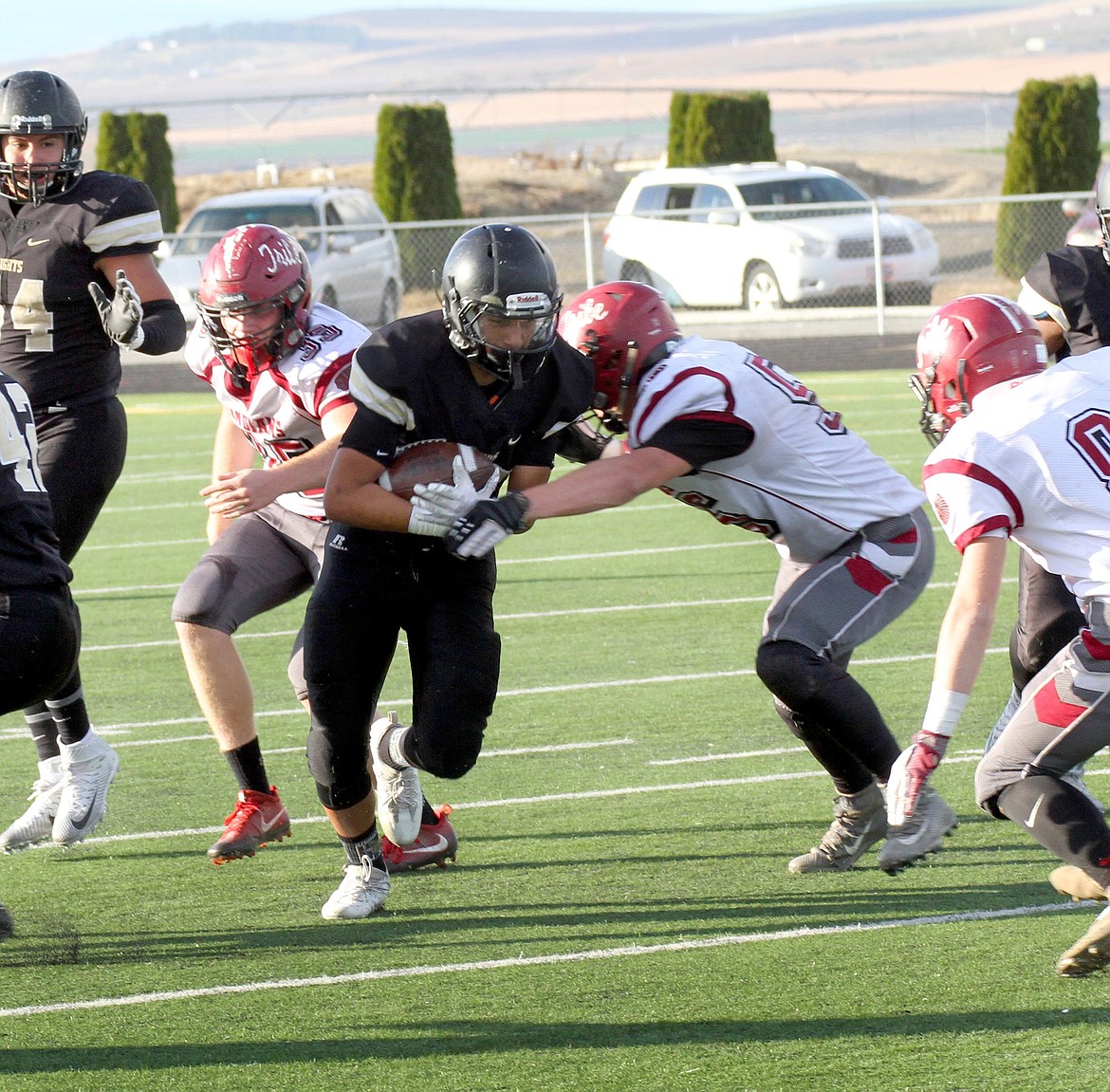 Pete Christensen Photo - Juan Ojeda gains eight yards after a pass from Kaden Jenks.