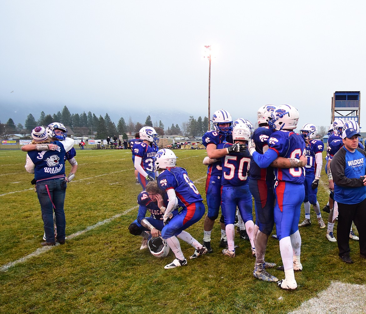 Teammates hug after a tough loss.