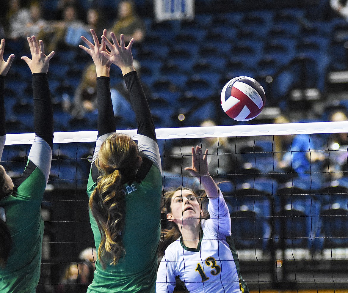 Mirielle Kruger goes for a kill during the Class A state volleyball tournament in Bozeman.