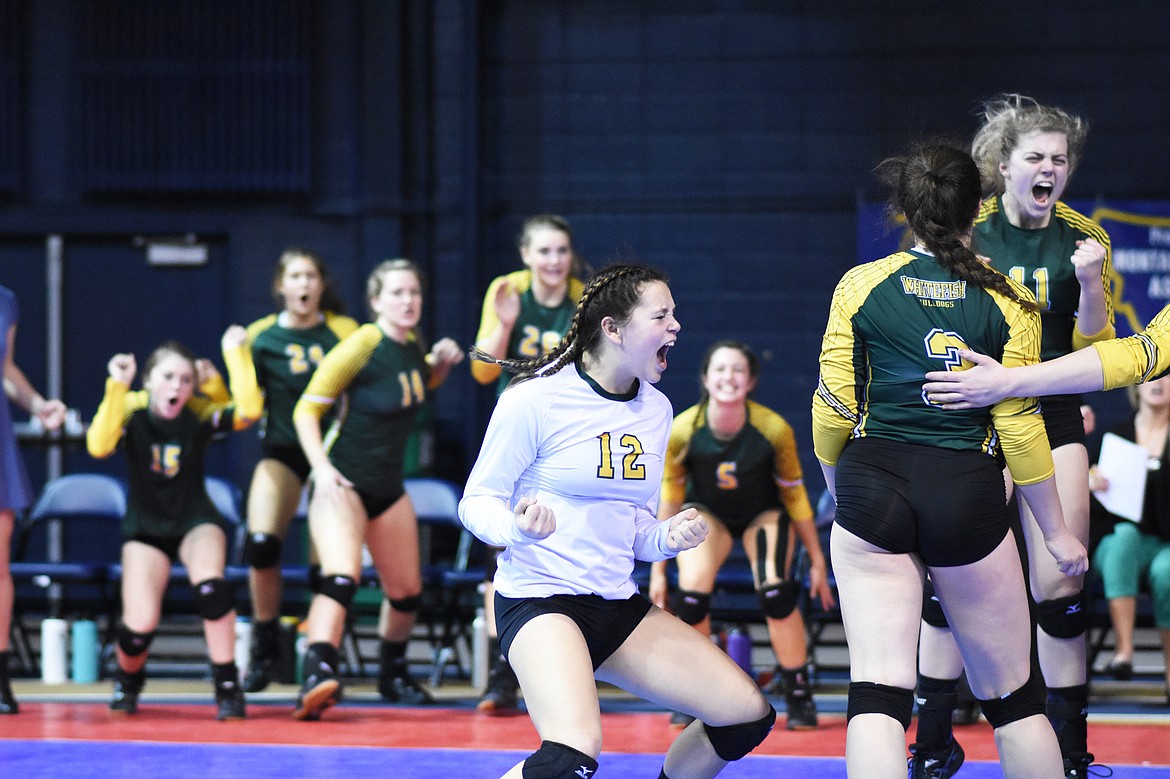 Serena Hemmingson celebrates with teammates during the Class A state volleyball tournament in Bozeman.