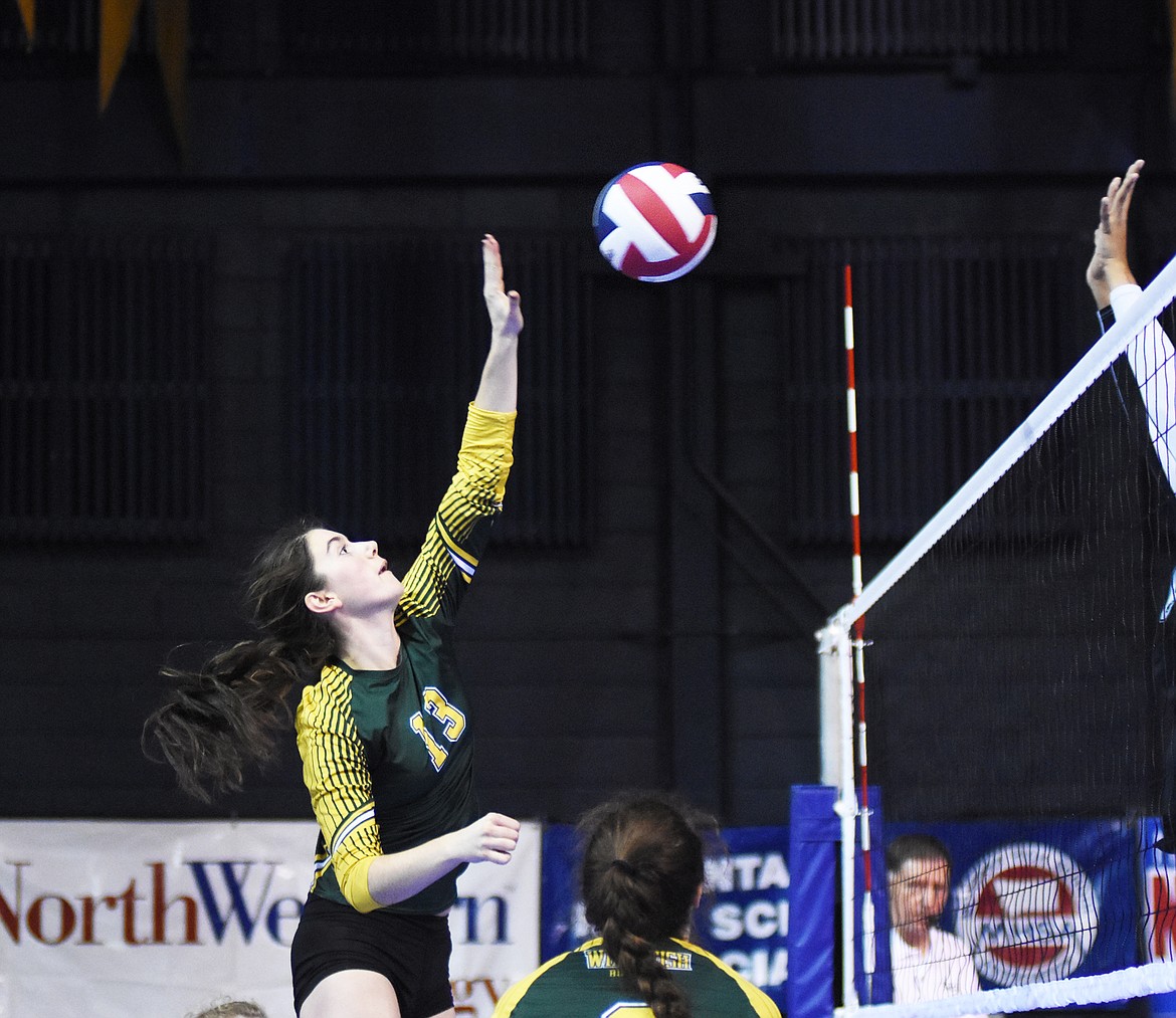 Mirielle Kruger rises for one of her 14 kills against Billings Central during the Class A state volleyball tournament in Bozeman.