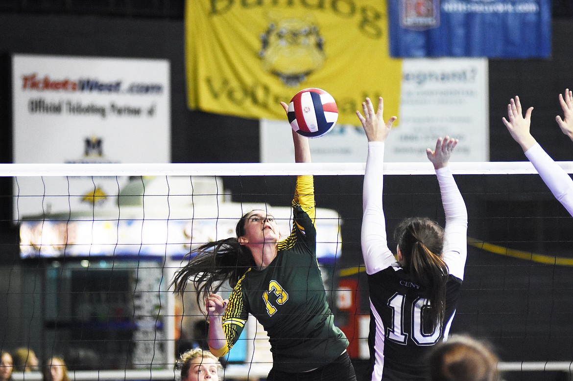 Mirielle Kruger gets one of her 14 kills against Billings Central during the Class A state volleyball tournament in Bozeman.