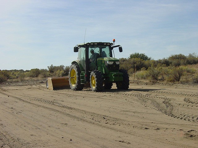 Ted Escobar/The Sun Tribune - Kene Christensen with his own equipment, leveling the cleared site.