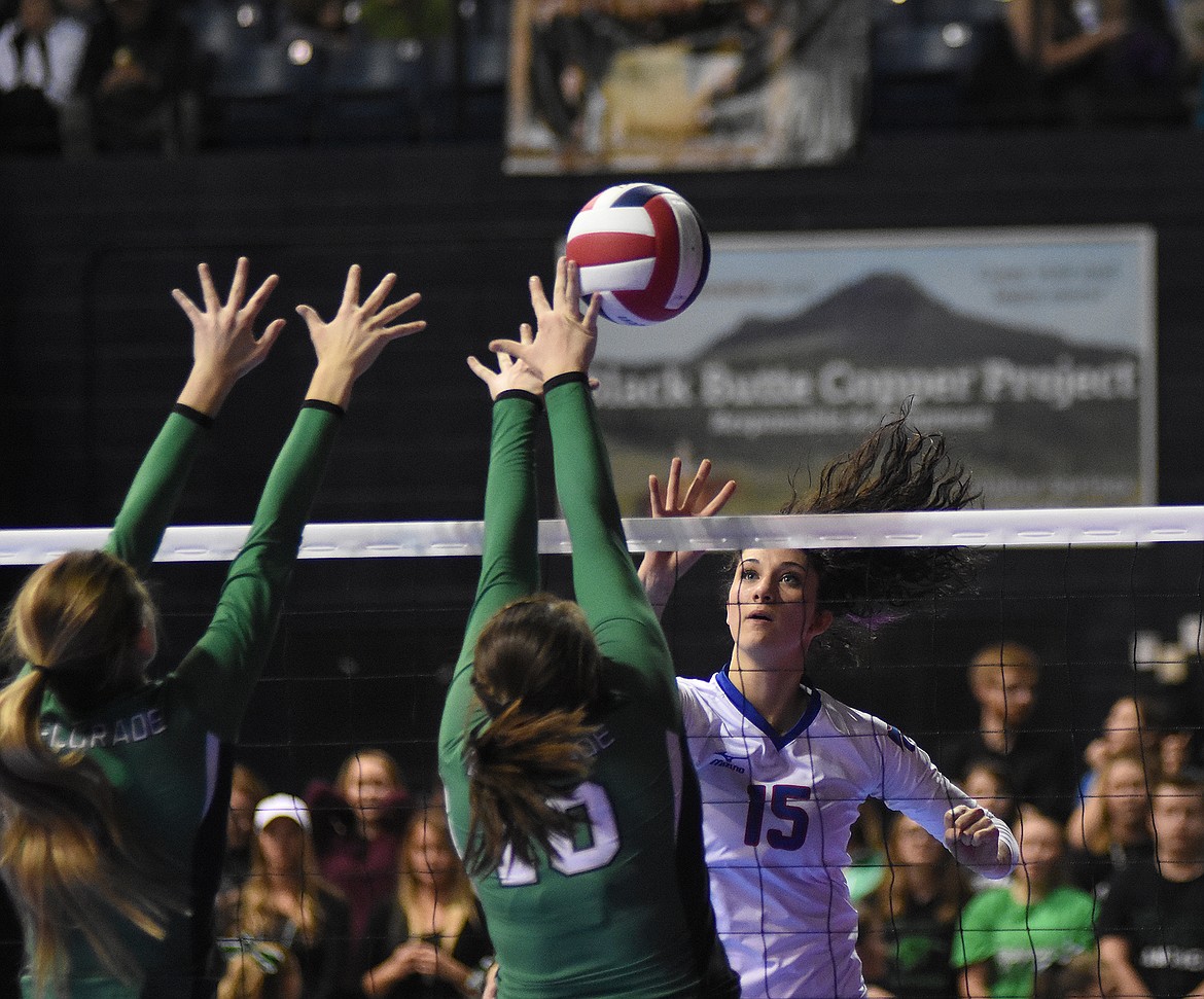 Morgan Stenger slaps the ball over the net against Belgrade.