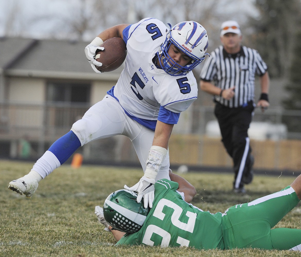 Wyatt Green breaks a tackle for extra yards against Belgrade. Dan Chestnet photo