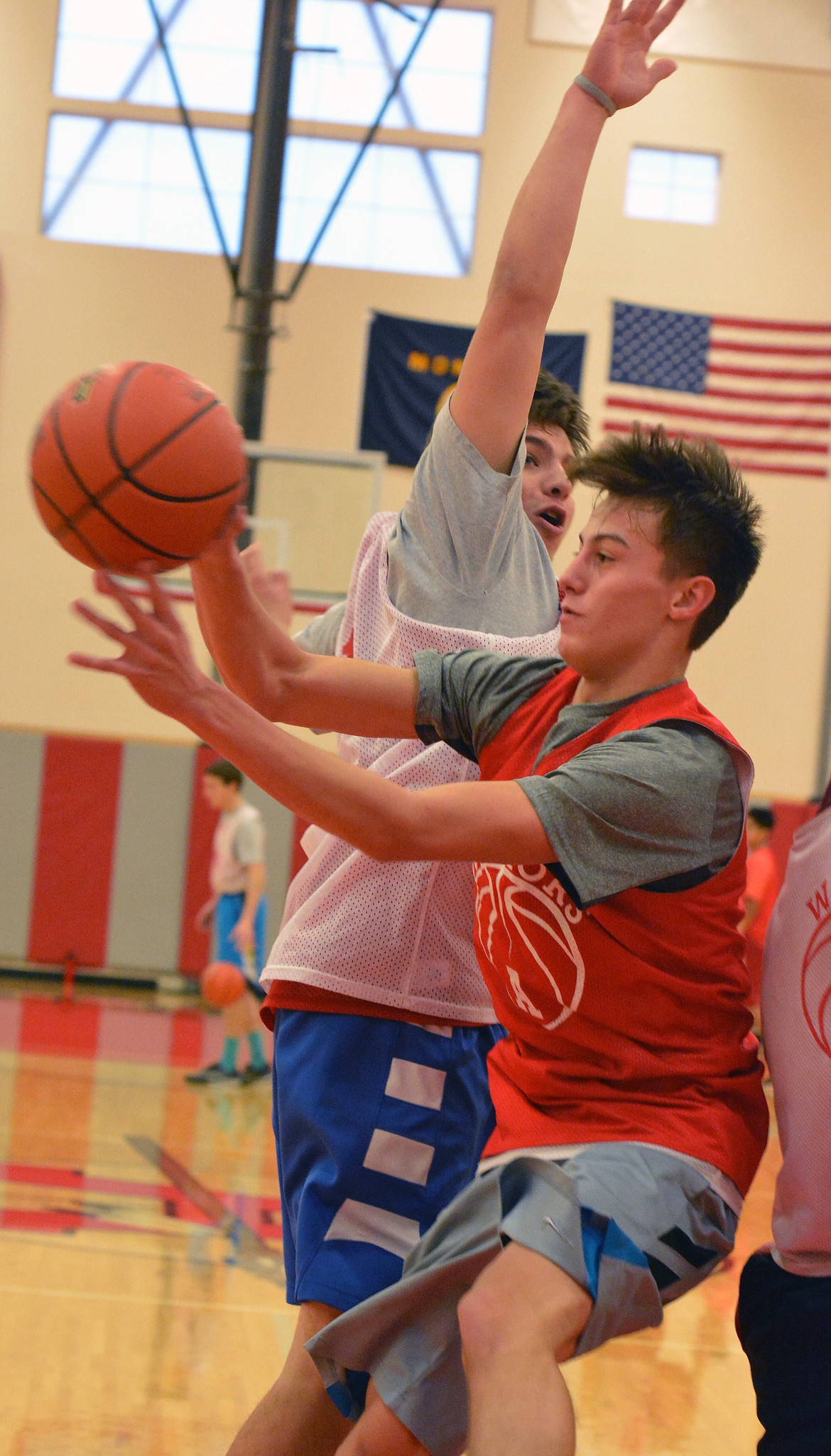 ARLEE PHIL Malatare looks for the open man while being guarded by Tyler Tanner during Friday mornings practice at Arlee High School. (Jason Blasco/Lake County Leader)