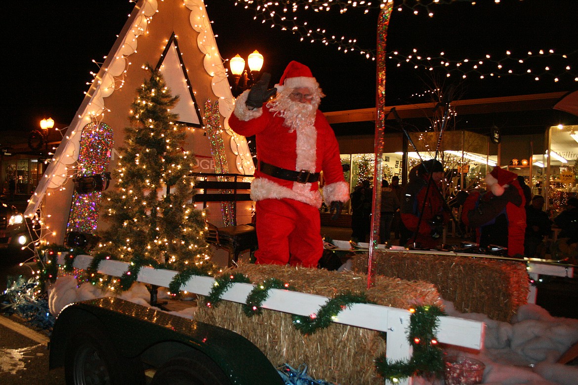 Columbia Basin Herald/file photo
Santa waves to the crowd along Third Avenue in Moses Lake during a past Ag Parade.