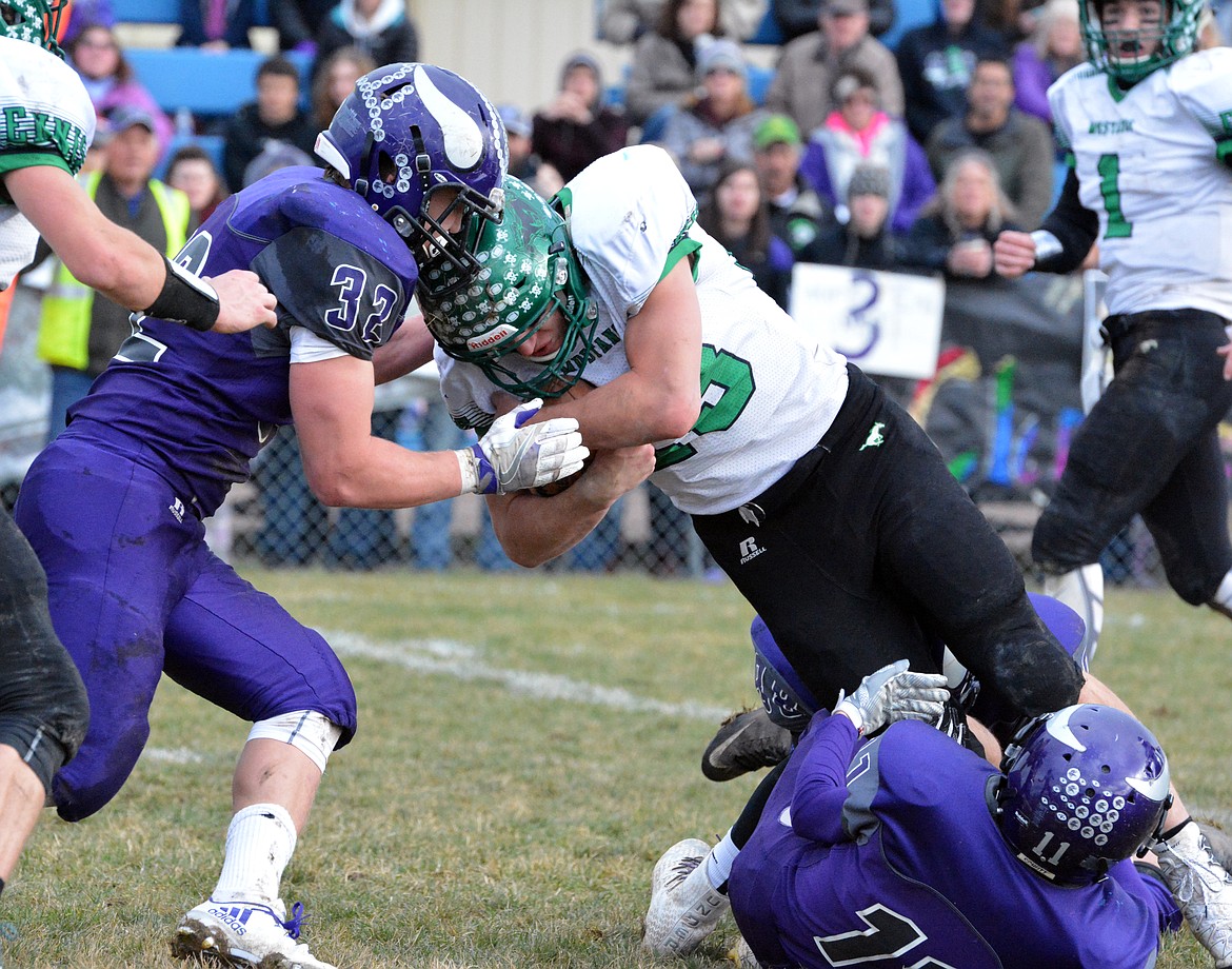 CHARLO VIKINGS Jared Doty prevents Ennis RB Jake Knack (23) from getting a successful 2-point conversion in the Class-C 8-man state football championship game Saturday at Charlo High School. (Jason Blasco/Lake County Leader)