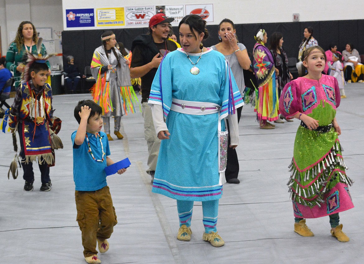 VALLEY RESIDENTS conduct a ceromonial dance at the Head Start Powwow Friday at Ronan High School.