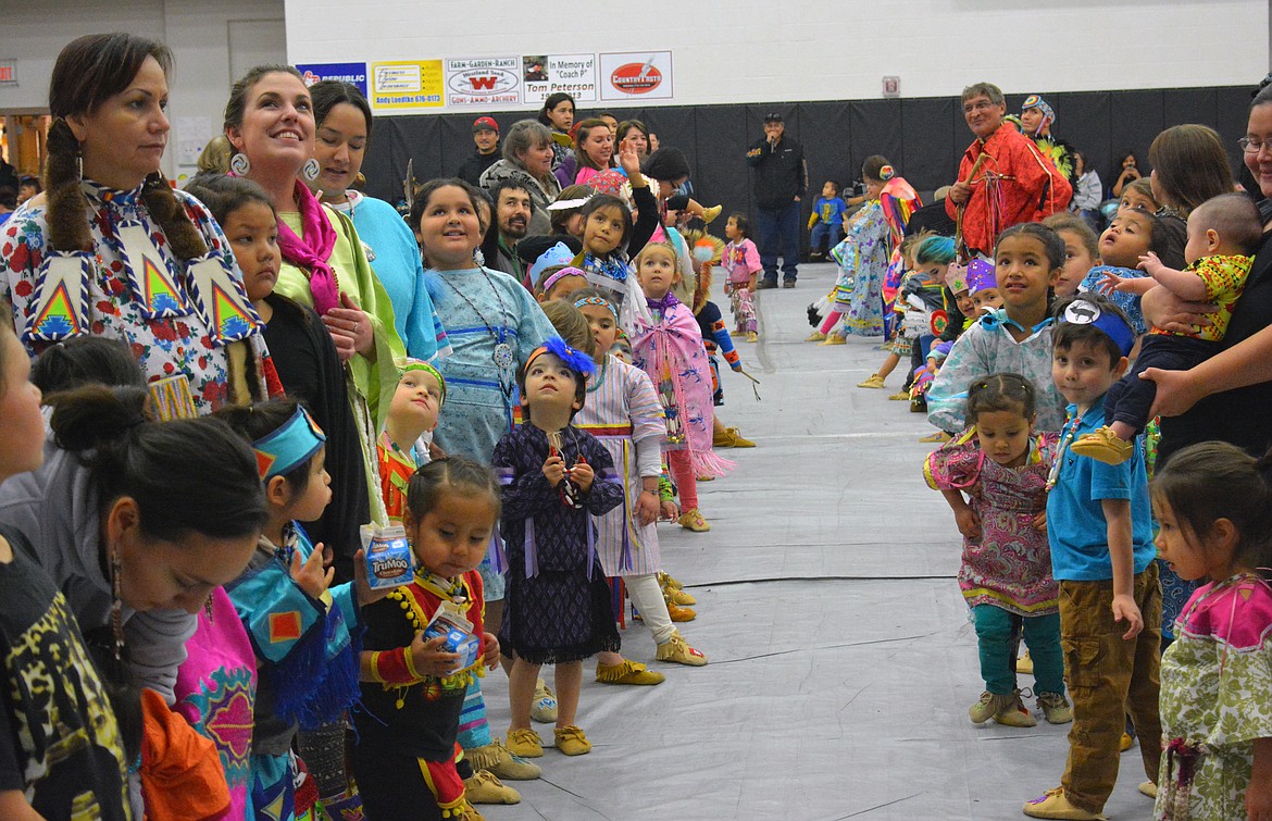 HEAD START students show off their moccasins to the crowd at the Head Start Powwow Friday night at Ronan High School. (Photos by Jason Blasco/Lake County Leader)