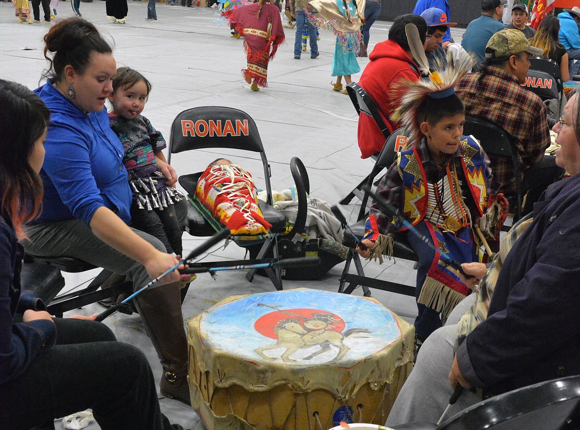 VALLEY RESIDENTS pound on the drums as part of a ceromonial dance at the Head Start pow wow Friday at Ronan High School. (Jason Blasco/Lake County Leader)