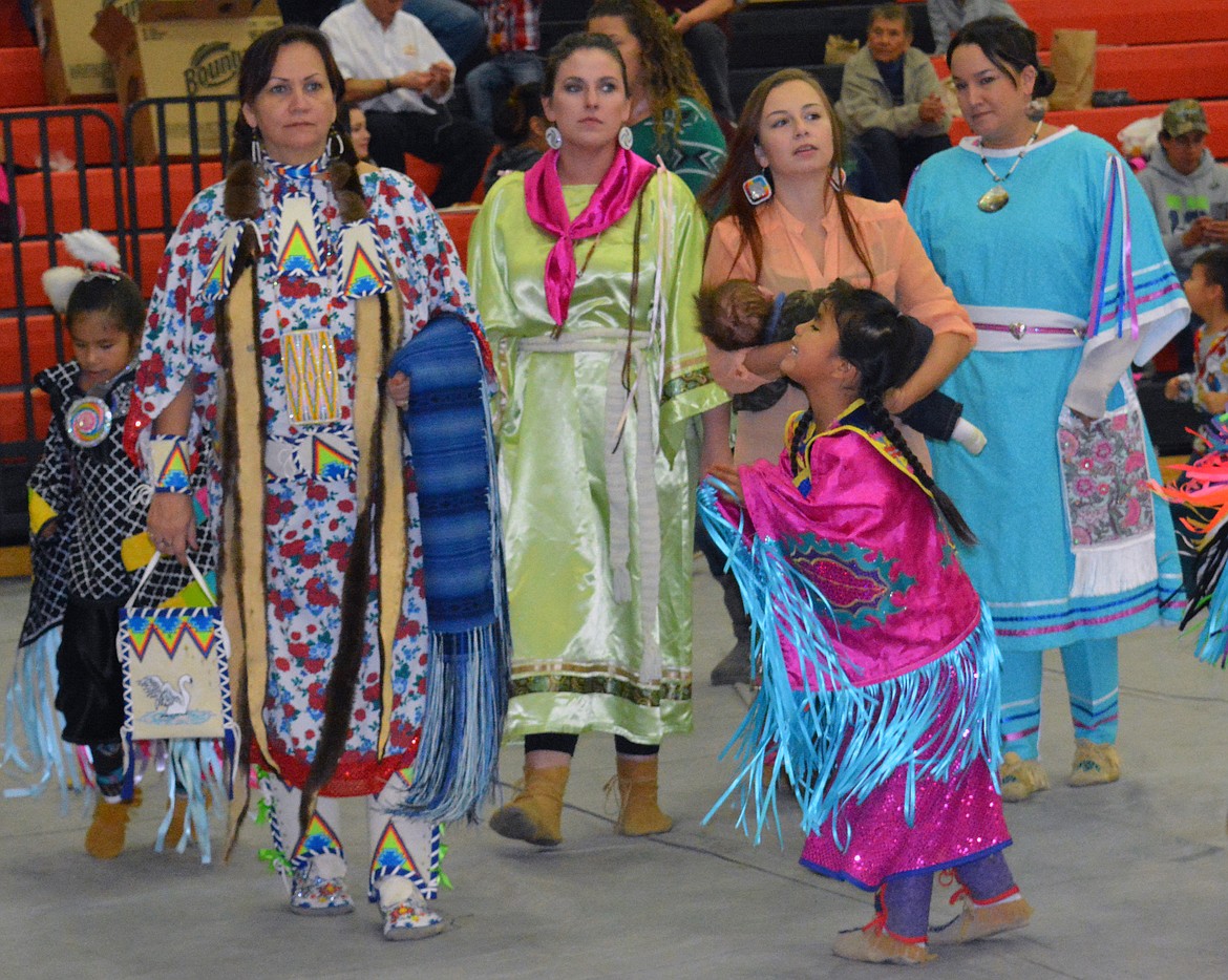 VALLEY RESIDENTS celebrate by dancing in their regalia at the Ronan powwow Friday at Ronan High School. (Jason Blasco/Lake County Leader)