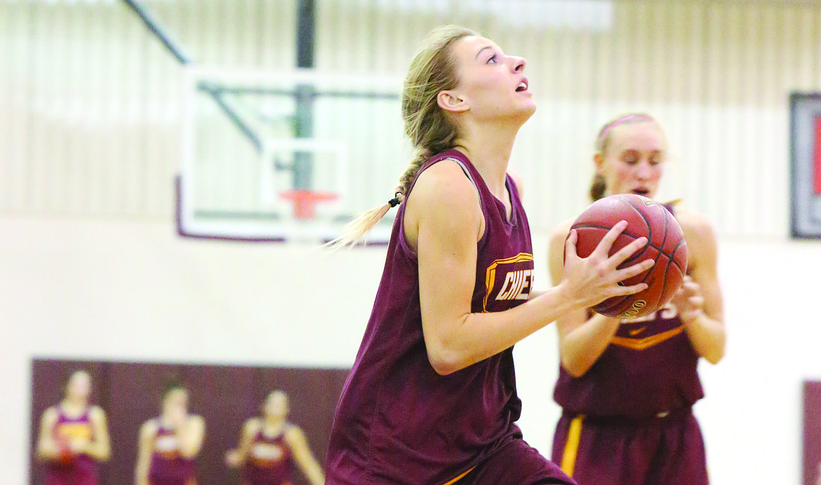 Connor Vanderweyst/Columbia Basin Herald
Jessica Olson goes up for a shot during practice.